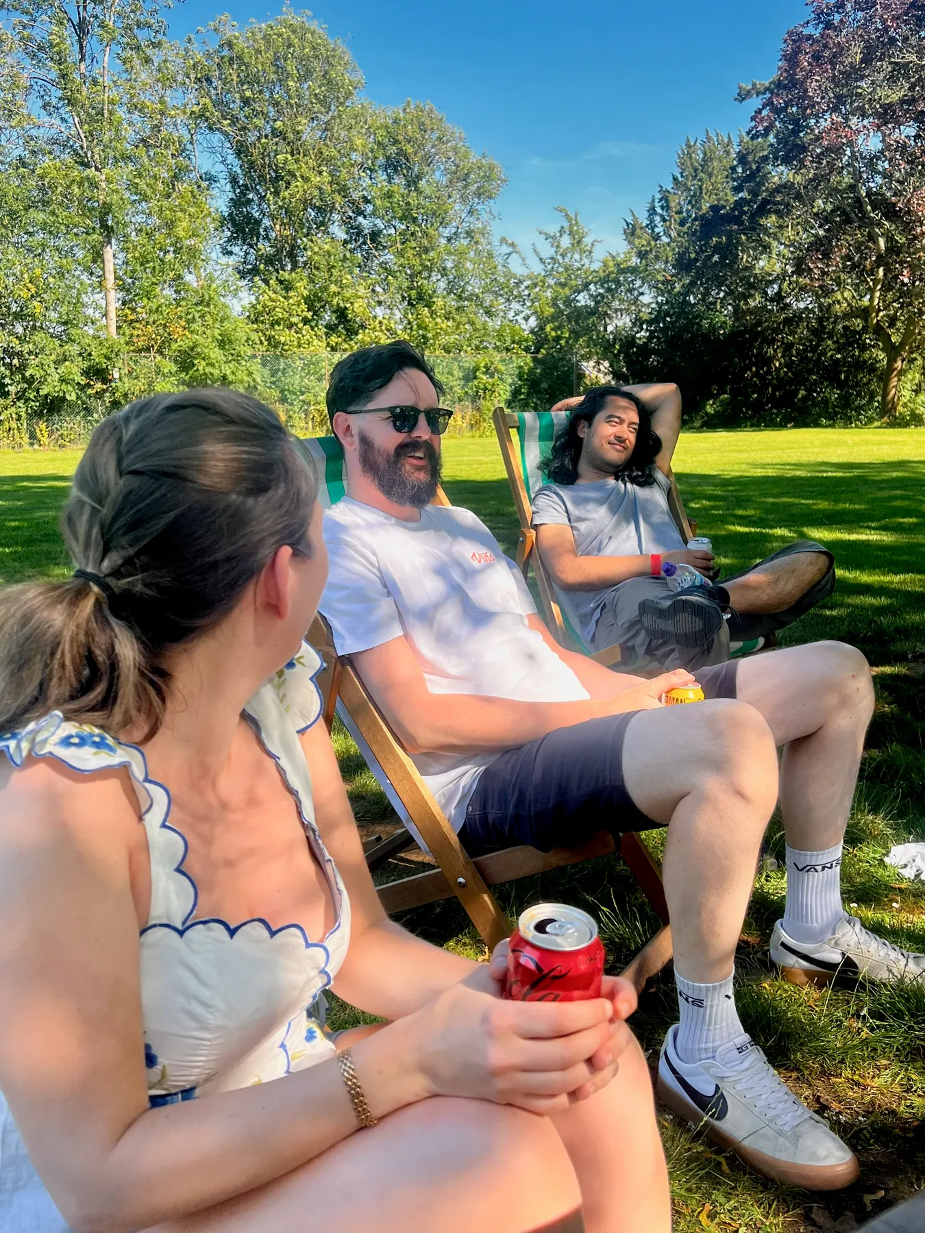 Colleagues relaxing in deckchairs on the lawn at Bletchley Park